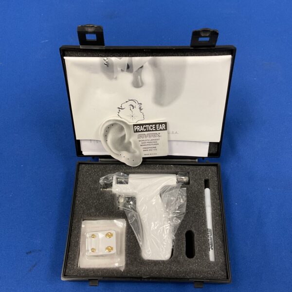 Vintage Studex System 75 ear piercing kit with applicator gun.