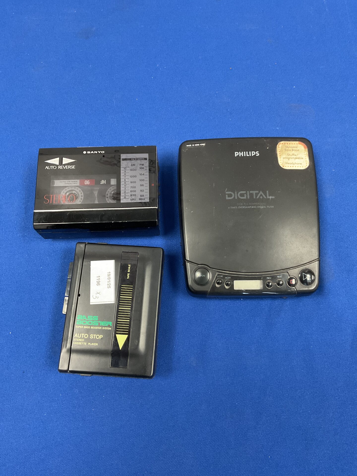 164 Three cassette & cd walkmans including sanyo & philips
