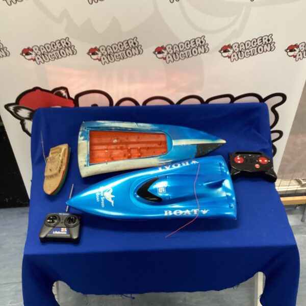 Blue RC speed boat for repair, remote control watercraft.
