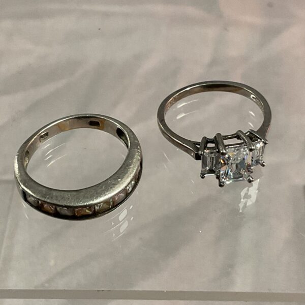 Pair of silver stone set rings, sizes M and N.