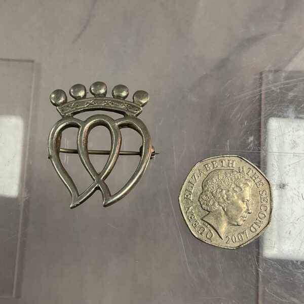 Vintage WWII Merchant Navy sweetheart brooch with anchor detail.