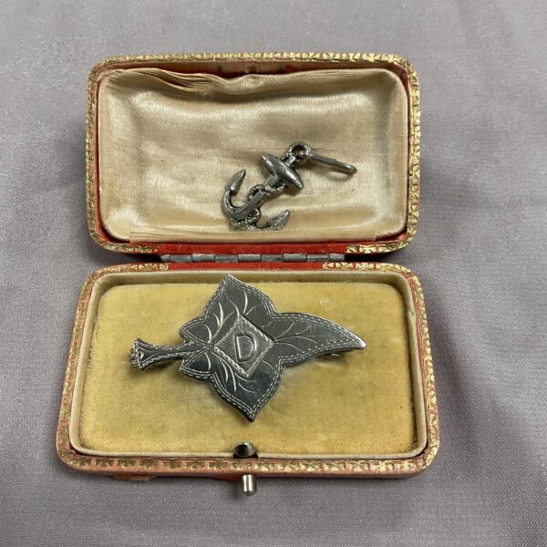 Vintage silver sweetheart brooches and fouled anchor pendant, military jewellery.