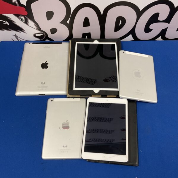 Lot of used Apple iPad tablets for repair or collection.
