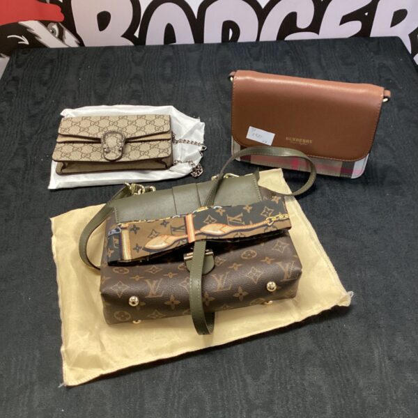 Designer handbag lot featuring Louis Vuitton, Gucci, and Burberry styles.
