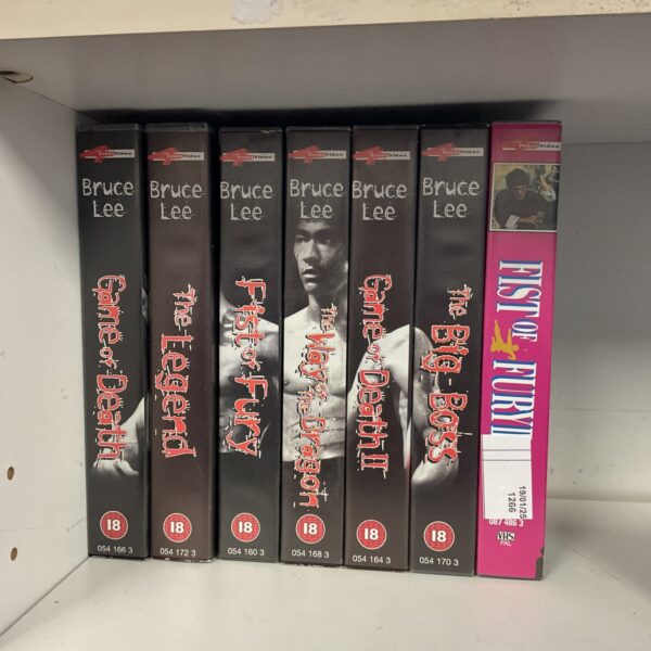 Vintage Bruce Lee VHS cassette lot for collectors.