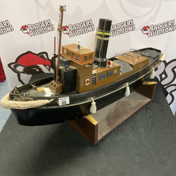 Detailed RC steam tug boat, Terrie aeronaut model on display.