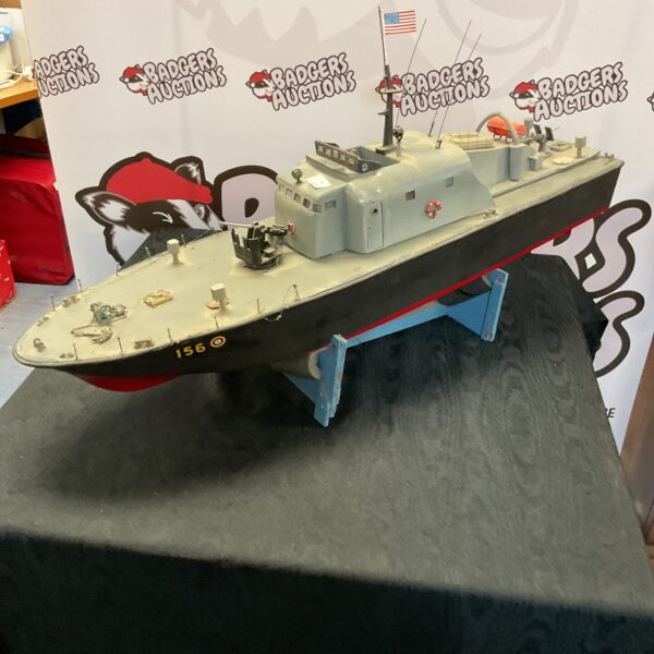 Detailed RC PT 156 torpedo boat model with stand.