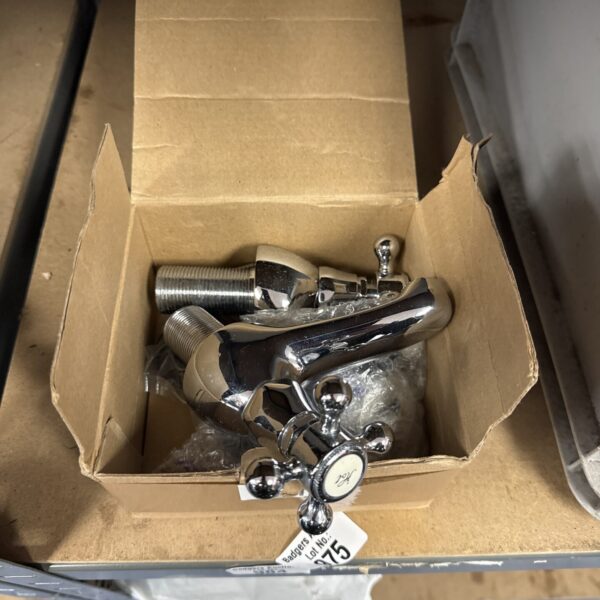 Pair of new chrome basin taps for bathroom sinks.