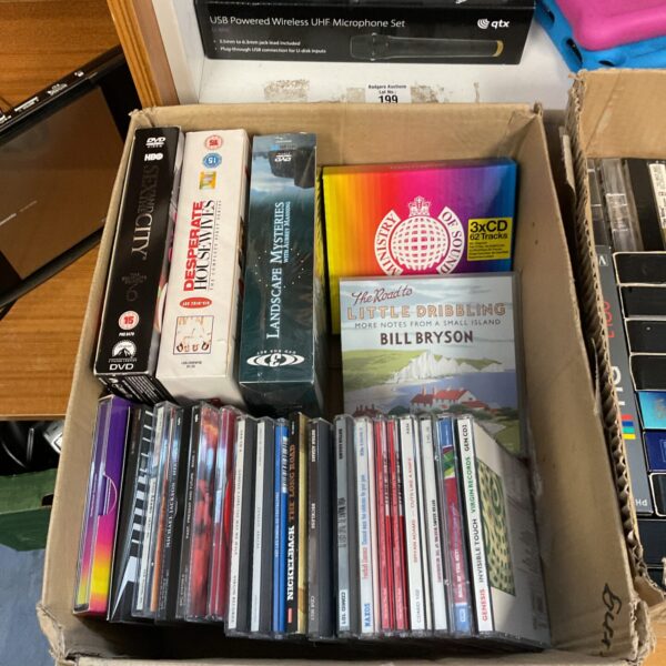 Selection of DVD box sets and music CDs for home entertainment.