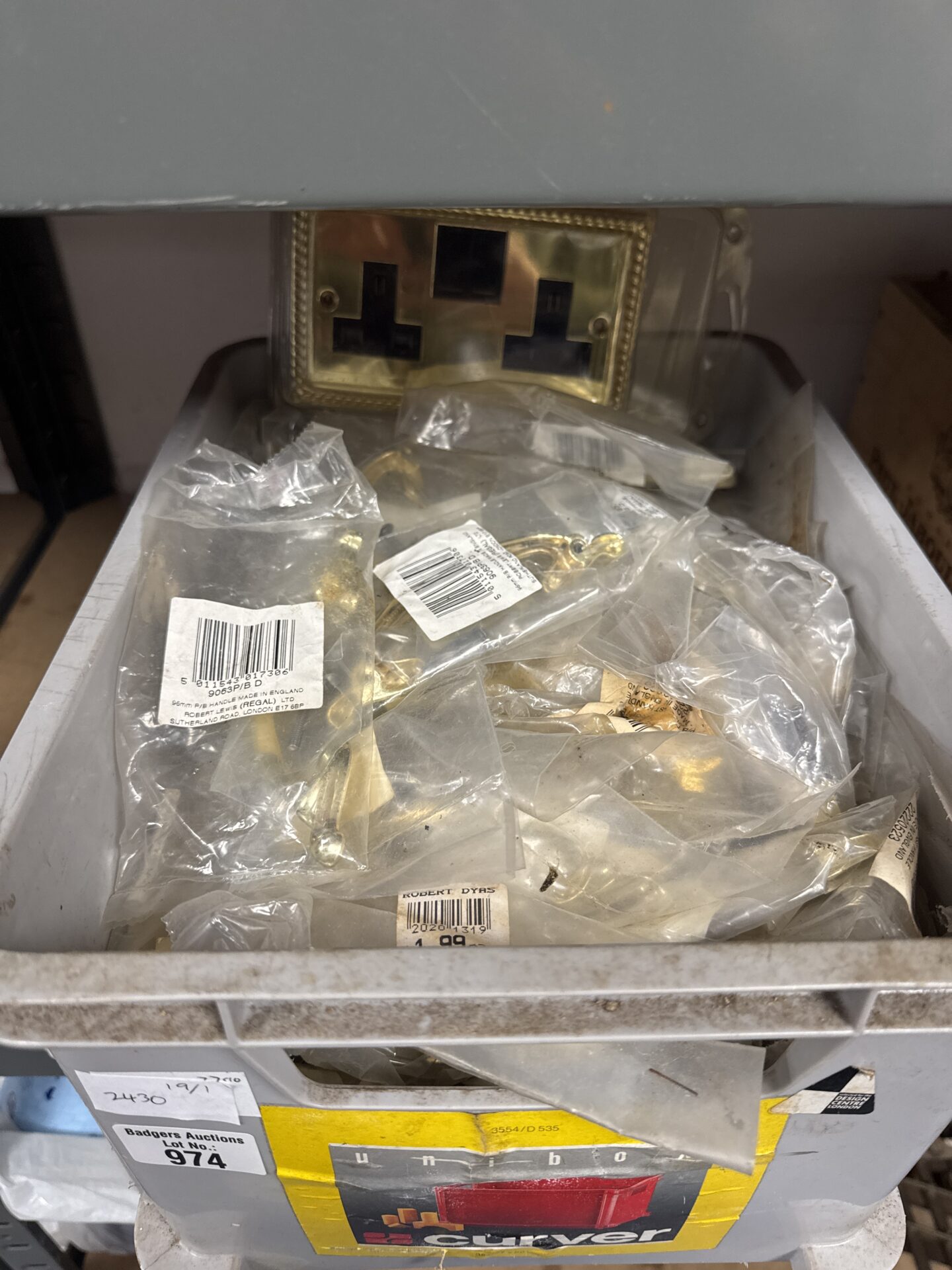 974 Box of regal ltd brass effect drawer handles with a double gang plug socket