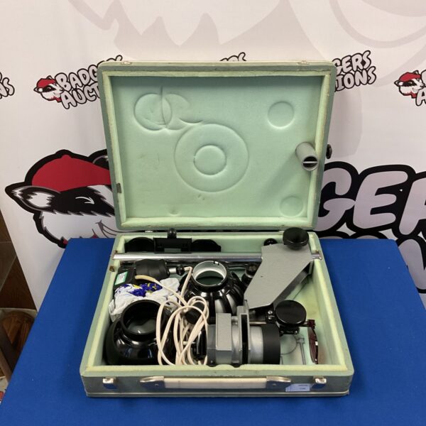 Vintage USSR photo enlarger kit in open case, showing components.