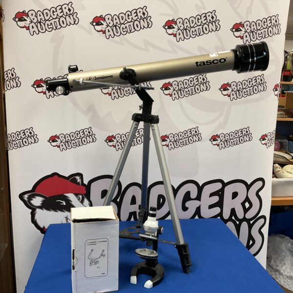 Vintage Tasco Luminova telescope and microscope set on tripod.