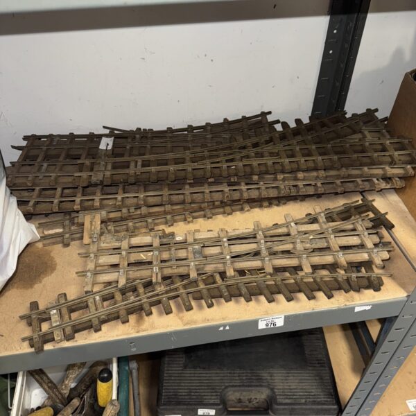 Vintage brass O gauge train track sections for model railroads.