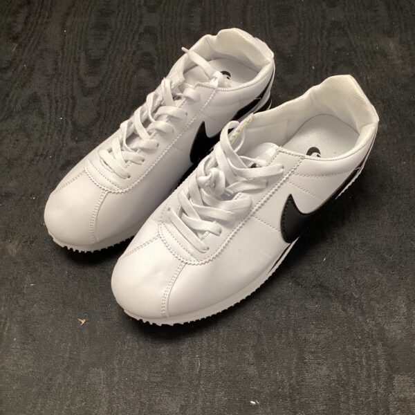 New white Nike trainers for sports and casual wear.