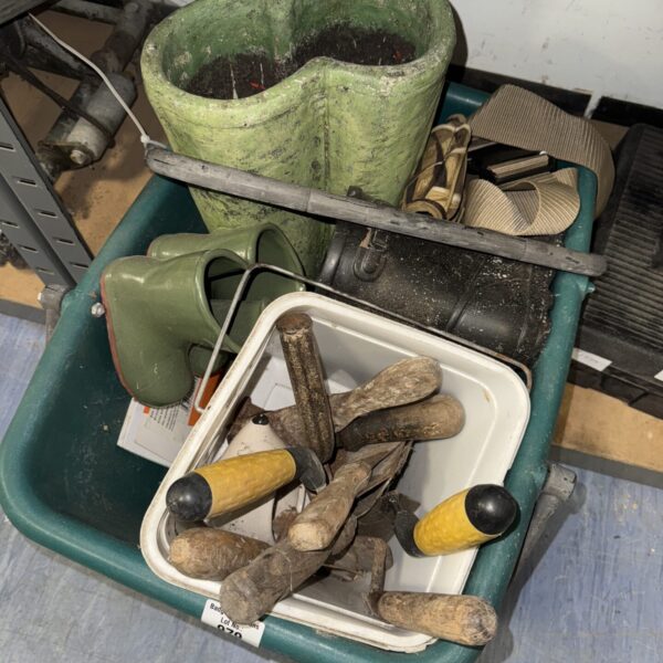 Vintage tools in a tub with welly boot planters.