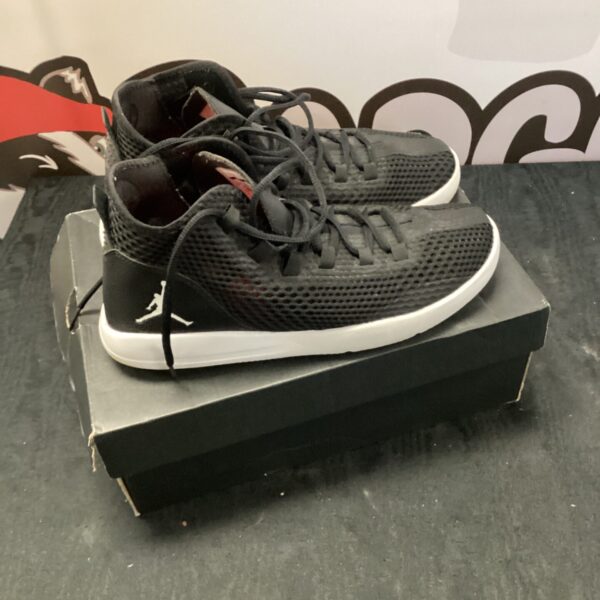 Black size 8 Nike Jordan trainers, athletic footwear.