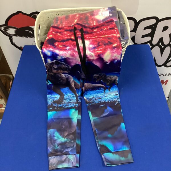Colourful kids dinosaur trousers with a vibrant print.