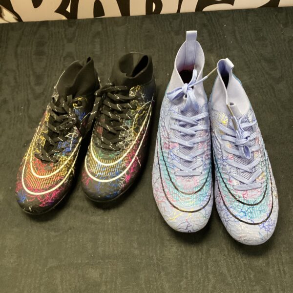 Dark patterned Nike football boots for sports performance.