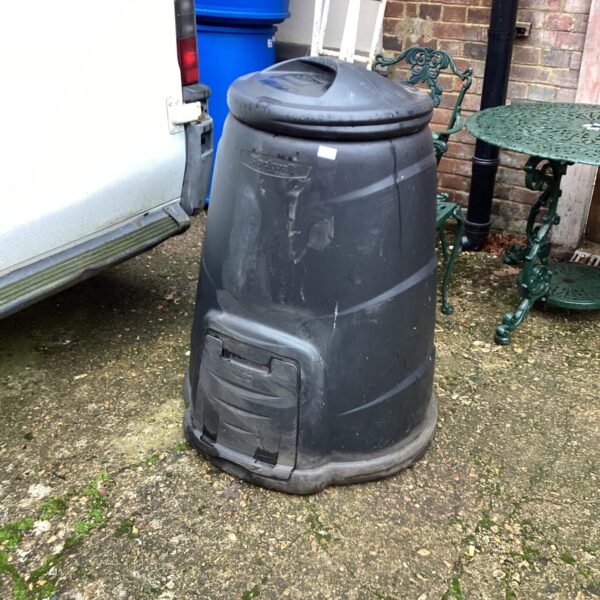 Black Blackwall garden composter in an outdoor setting.
