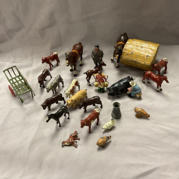 Vintage lead farm animals and farmer figure collection.
