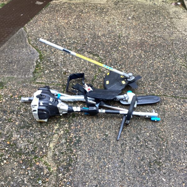 Used Mac Alister petrol garden multi tool with attachments for garden maintenance.