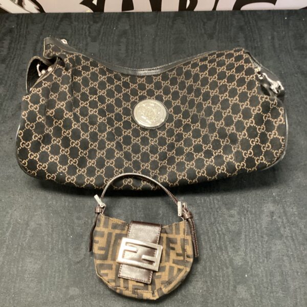 Designer handbag lot featuring Gucci and Fendi styles.