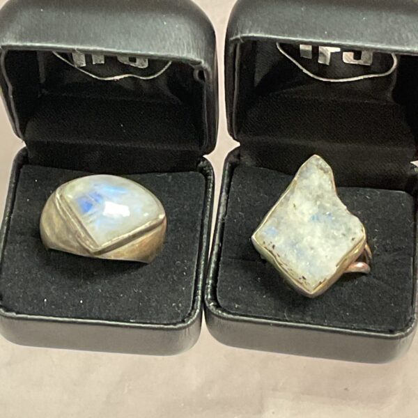 Pair of silver rings with moonstone gemstones.