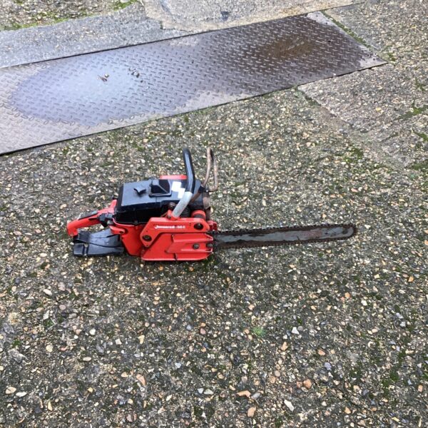 Vintage Jonsered chainsaw in used condition, ideal for collectors.