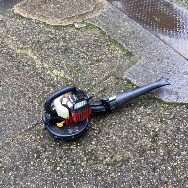 Vintage Homelite petrol leaf blower for garden cleaning.