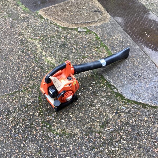Used petrol leaf blower for garden maintenance, showing the handheld power tool.