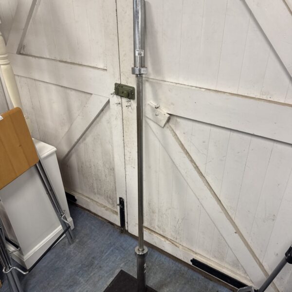 Steel Olympic barbell for weightlifting and gym use.