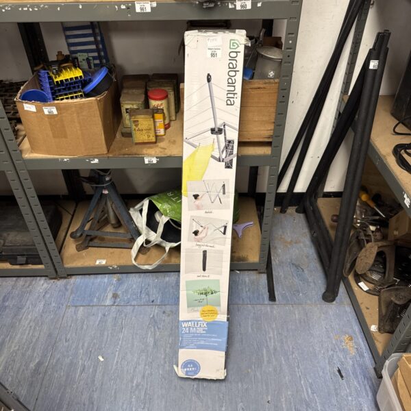 Brabantia wall mounted folding clothes dryer in a storage setting.