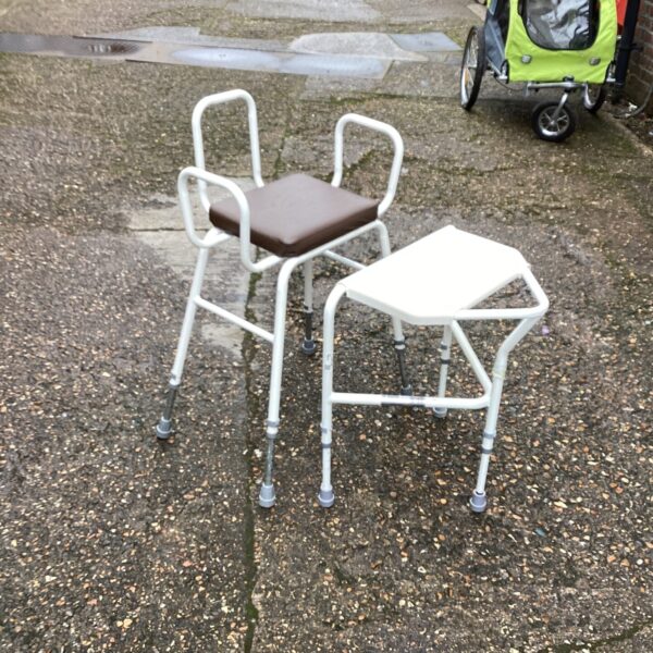 Adjustable Aidapt chair and table for mobility assistance.