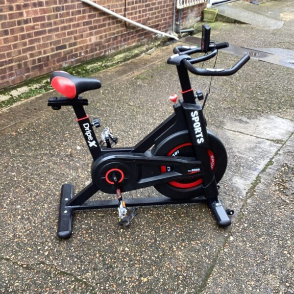 Front view of a Dripex exercise bike for home fitness.