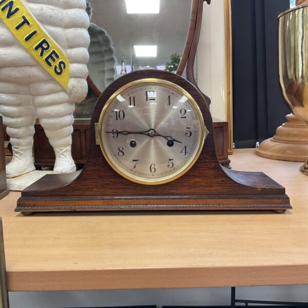 Vintage German Art Deco mantle clock on display.