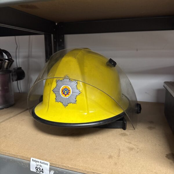 Yellow Comax fire helmet for firefighters and rescue personnel.