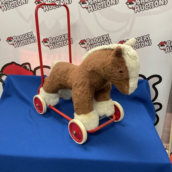 Vintage Deans ride-on horse, a classic toy for collectors.