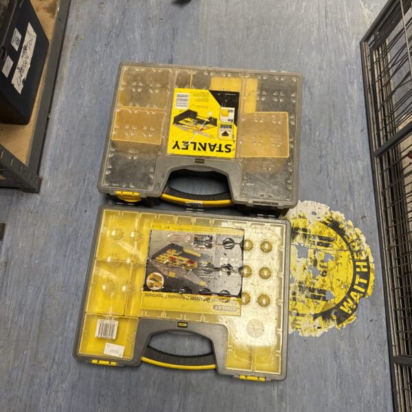 Pair of used Stanley storage trays for tool organisation.