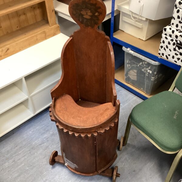 Vintage wooden baby commode with shaped back.