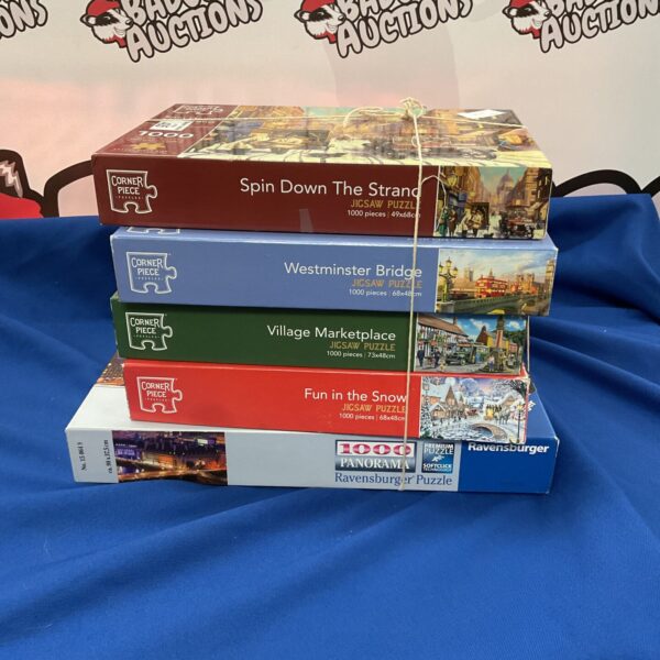 Lot of five 1000-piece jigsaw puzzles by Ravensburger.