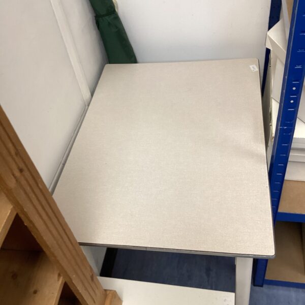 Vintage formica topped table with signs of wear.