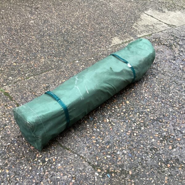 Rolled telescopic gazebo cover for garden shelter.