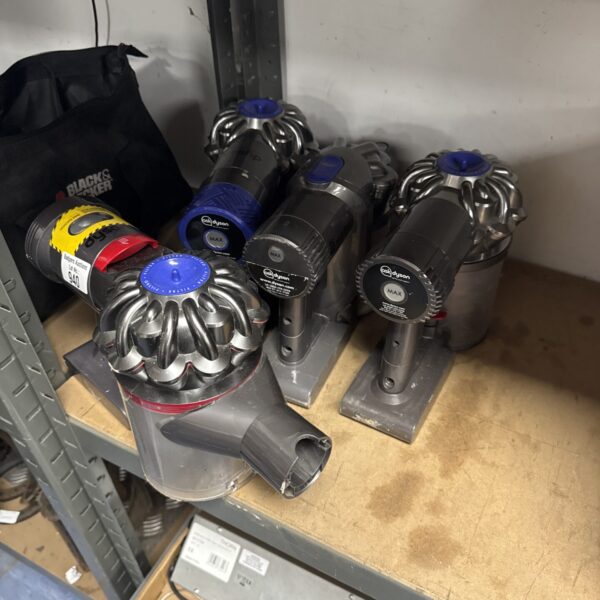 Lot of four Dyson handheld hoover bodies for repair.