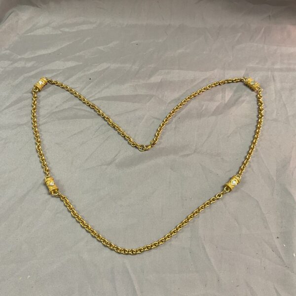 Vintage Monet gold tone necklace with clear stones.