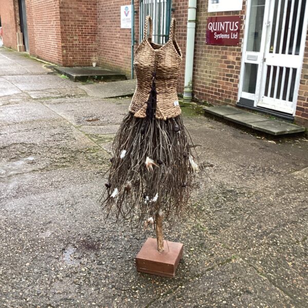 Unique modern art sculpture made of woven reeds and branches.