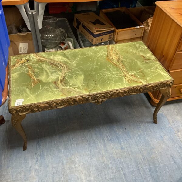 Elegant vintage French style marble top table with ornate detailing.