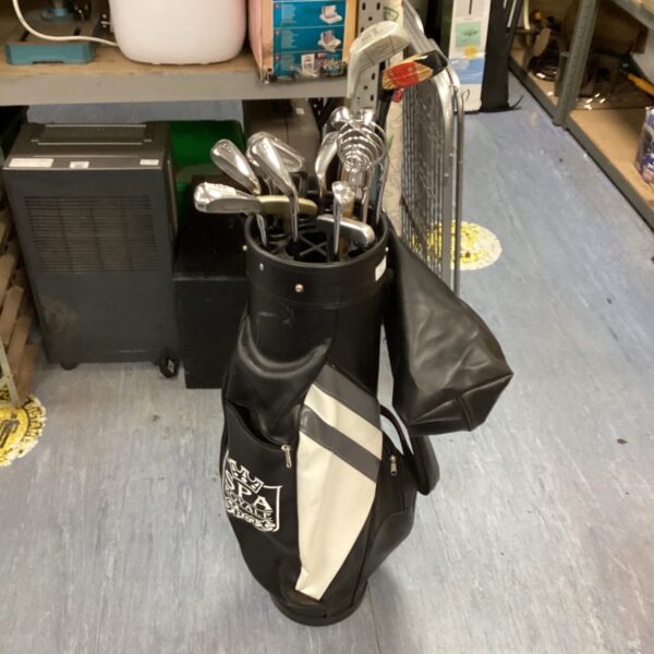 Vintage Browning golf club set with bag, showing signs of wear.