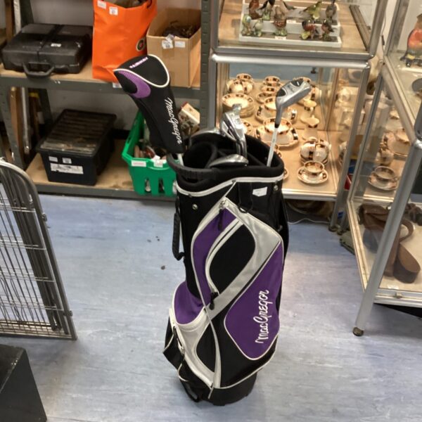 Vintage MacGregor golf club set with bag, sporting goods.
