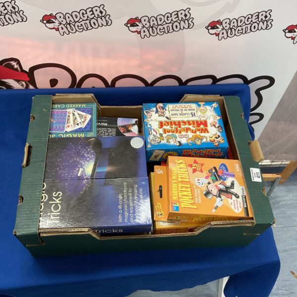 Vintage box of magic tricks and illusions with card tricks.