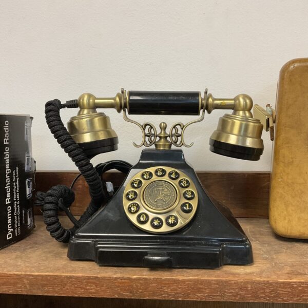 Close-up of a vintage rotary dial telephone.